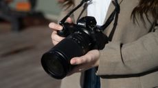 Nikon Z 28-400mm f/4-8 VR in the hand