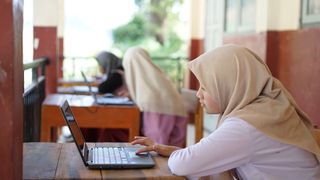 Indonesian junior high school students study online using chromebook laptops
